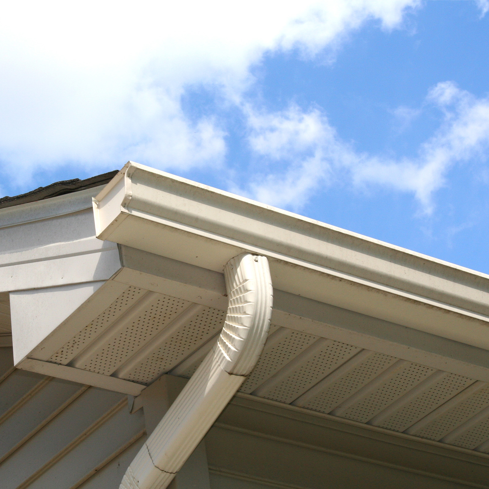 House Gutter and Downspout with Sky